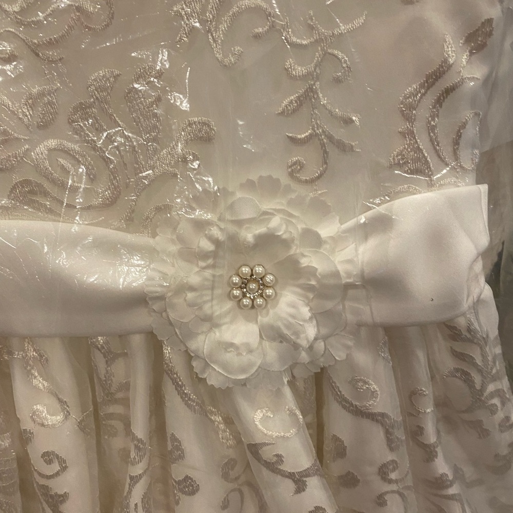 Size 10 ivory flower girl dress with flower on the side